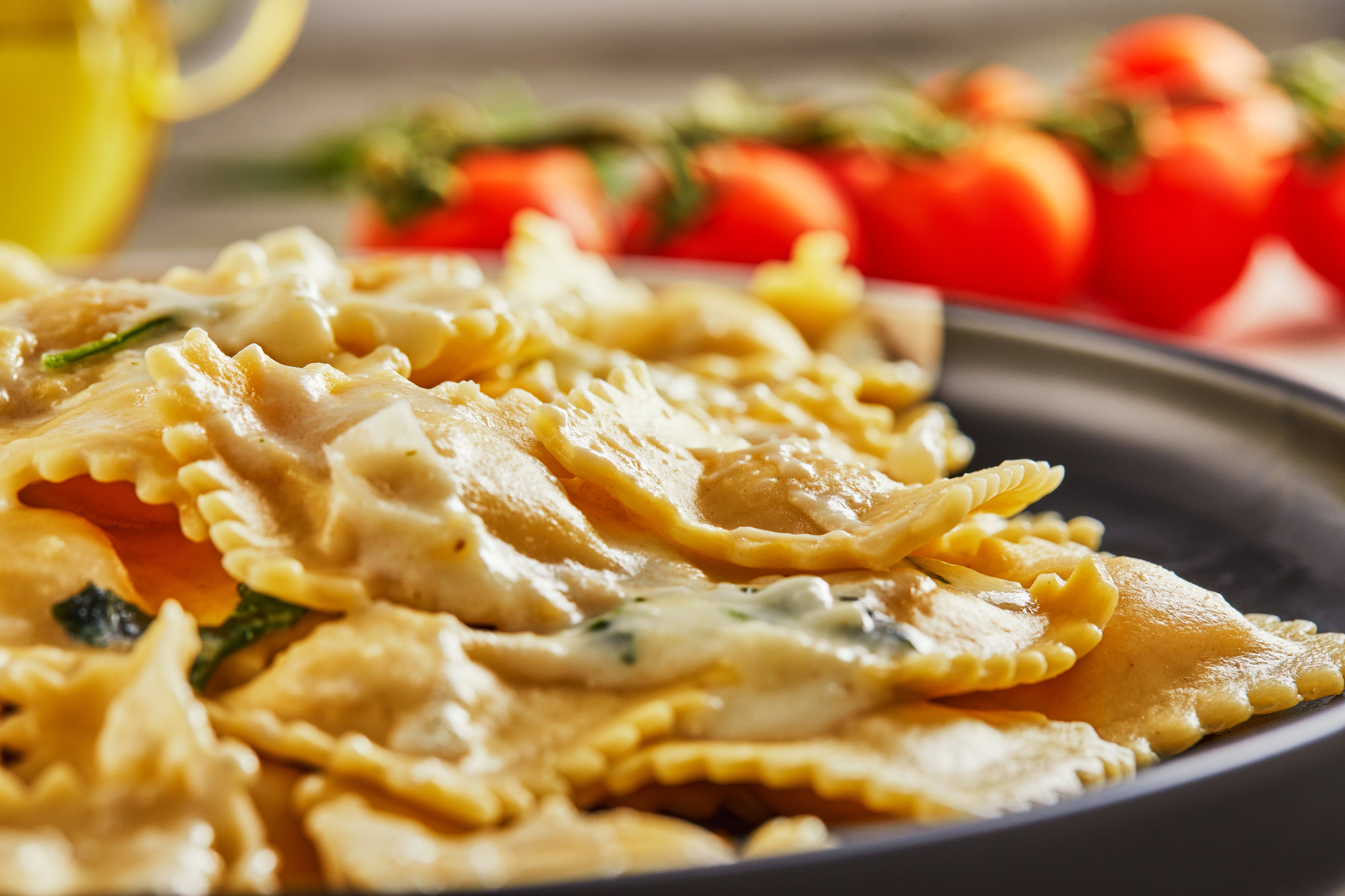 tasty-cooked-ravioli-with-cream-sauce-cherry-toma-2023-11-27-05-30-42-utc